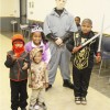 Kids showing off their costumes with Halloween's Jason.